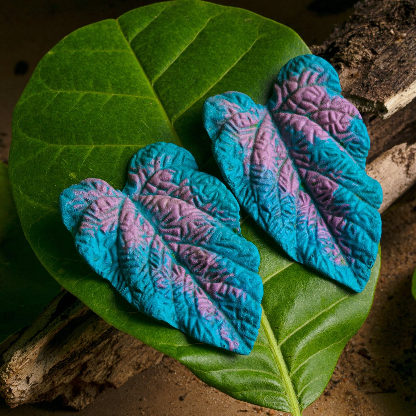 Handcrafted earrings: Natural rubber & açaí seed fiber (nickel-free). Blue & purple leaf design with intricately painted veins. Eco-friendly & beautiful.