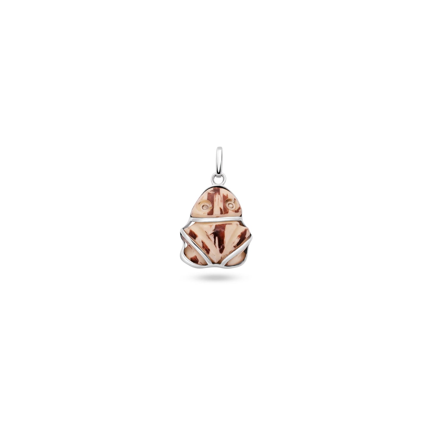 A Muiraquitã frog-shaped pendant made from Jarina seed set in sterling silver, blending ancient Amazonian tradition with eco-conscious materials.