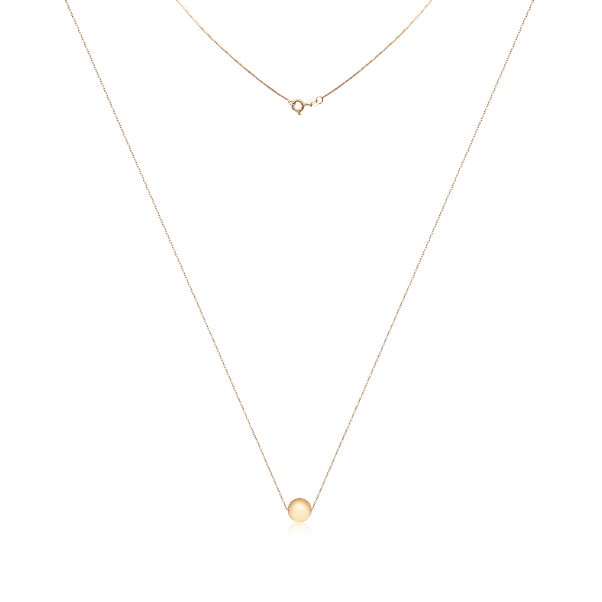 An 18k gold necklace with a smooth, circular pendant, exuding simplicity and elegance, symbolizing eternal unity.