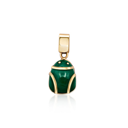 An 18k gold frog-shaped pendant with a glossy malachite body, capturing the essence of the Amazon in a luxurious, handcrafted design