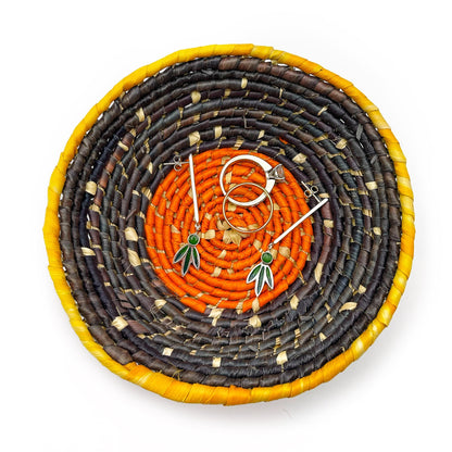 Handwoven bowl with vibrant colors: yellow rim, dark brown & black bands, bright orange center. Includes earrings & rings (for display) to showcase storage for small items.