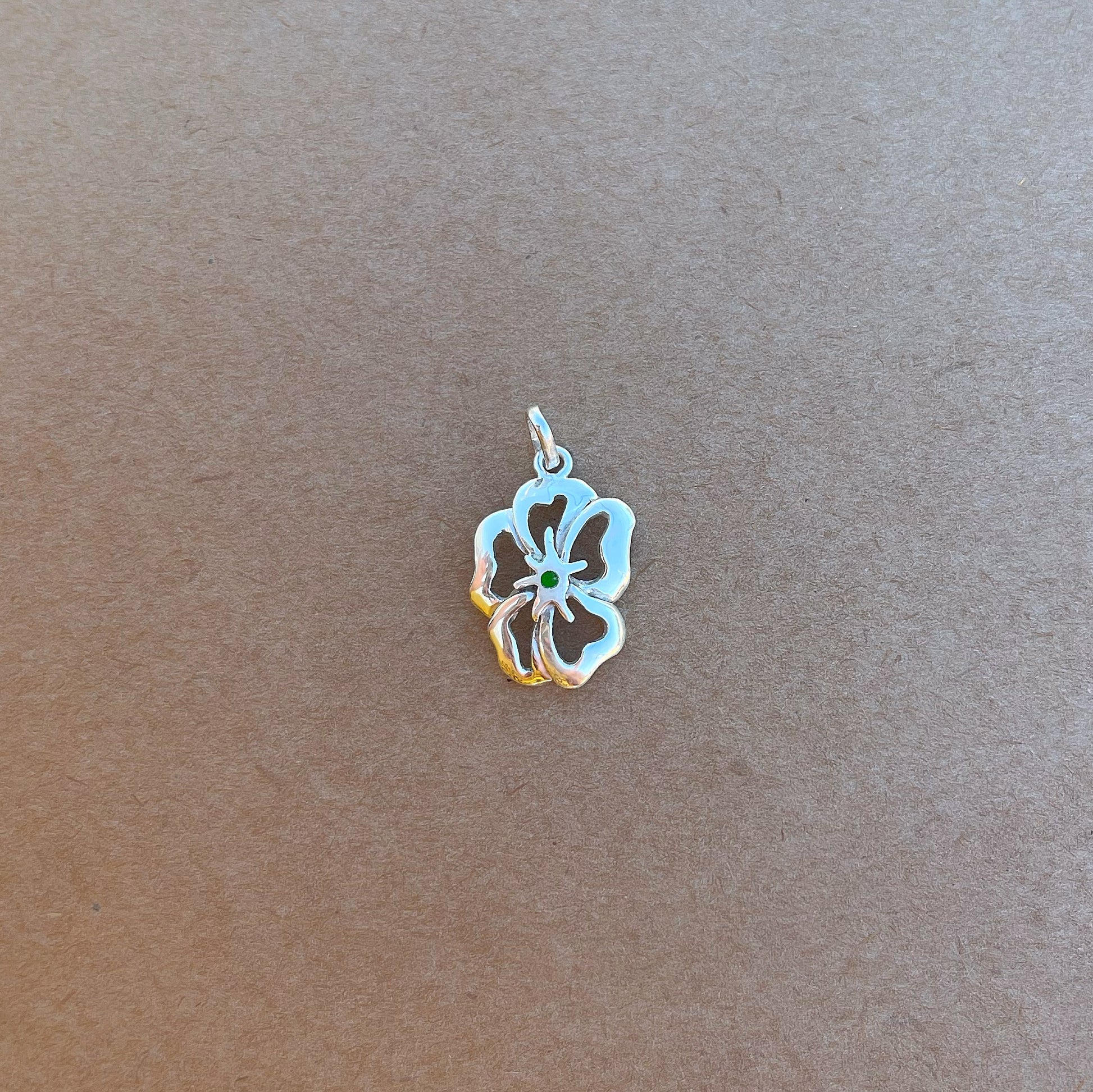 925 sterling silver necklace featuring a flower-shaped pendant with five petals. The center petal has a green malachite inlay