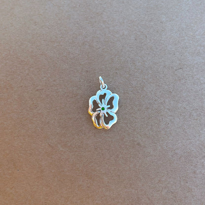 925 sterling silver necklace featuring a flower-shaped pendant with five petals. The center petal has a green malachite inlay