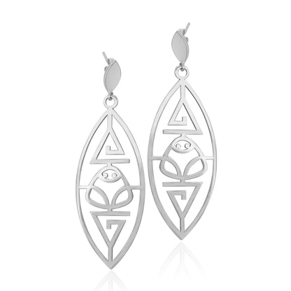 silver Marajoara earrings, showcasing traditional muiraquitã patterns with elegant cut-out designs.