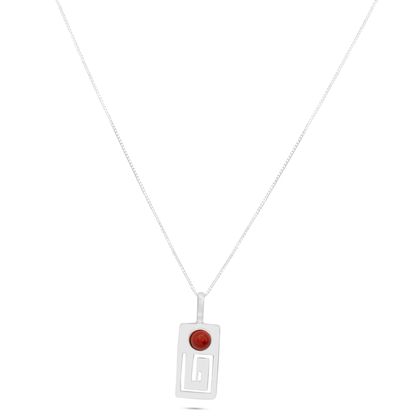 A sterling silver pendant with a red jasper gemstone, featuring minimalist art inspired by ancient Marajoara civilization, suspended on a delicate chain.