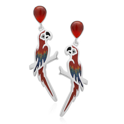 Silver parrot earrings with red agate accents, showcasing artisanal craftsmanship and vibrant Amazonian hues.