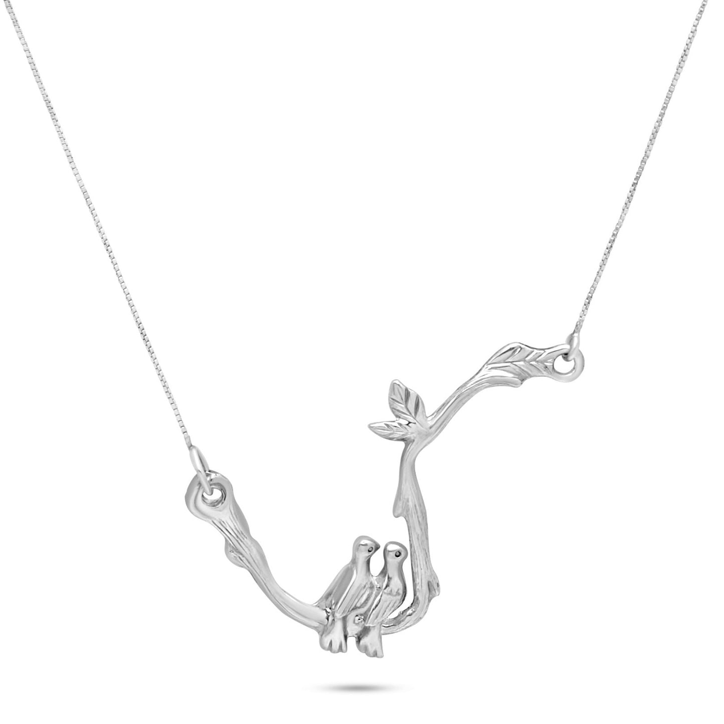 Sterling silver necklace with a detailed intertwined doves design on a curved branch. Each dove is meticulously sculpted, and the branch features a realistic texture and leaves. This intricate craftsmanship highlights a strong connection to nature.