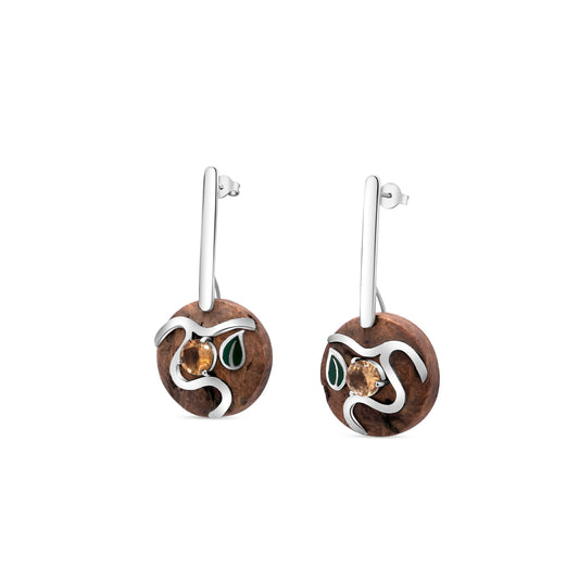 Handcrafted earrings made from sustainable Brazil nut material and sterling silver, adorned with genuine citrine stones and leaf-green embellishments, showcasing artisanal craftsmanship.