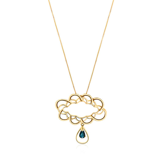 18k gold cloud pendant with a blue sapphire teardrop. Luxurious design with vibrant blue stone.