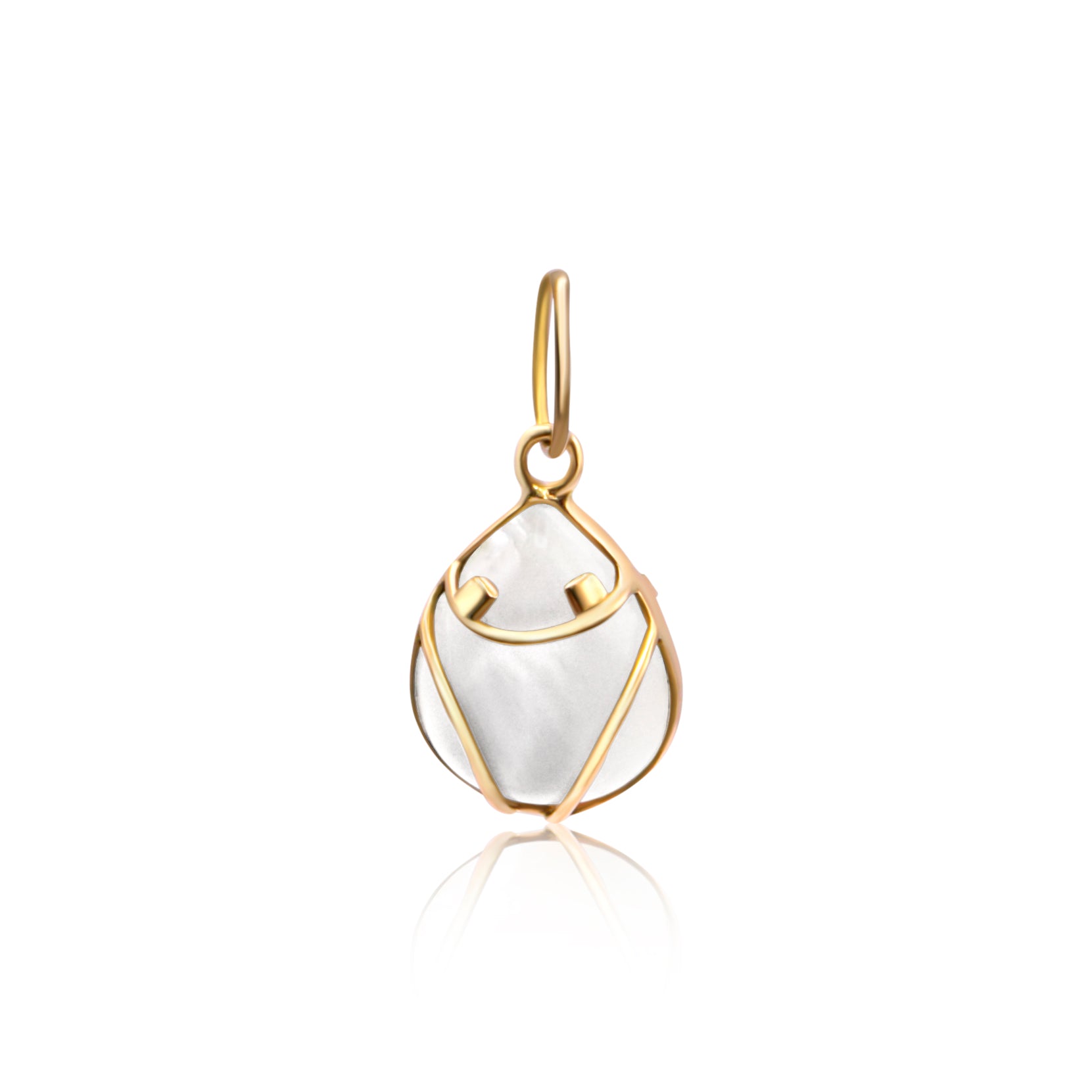 Gold pendant with a mother-of-pearl inset, designed in the stylized shape of a Muiraquitã frog, displayed on a reflective surface.