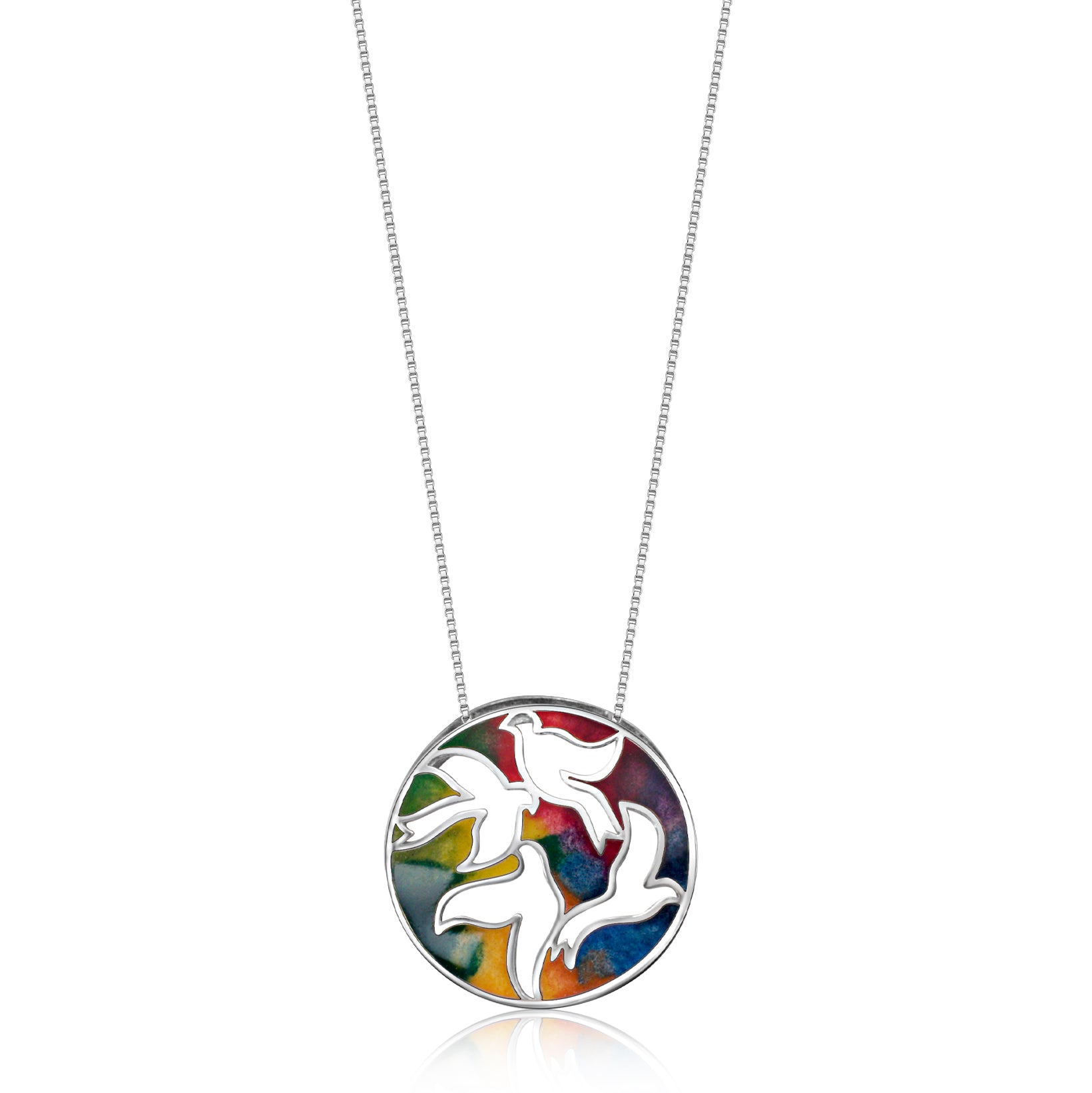 A silver necklace with a circular pendant featuring an artistic rendition of birds in flight, set against a colorful enamel background that captures the fluidity and grace of a bird's revoada, or flock in motion.