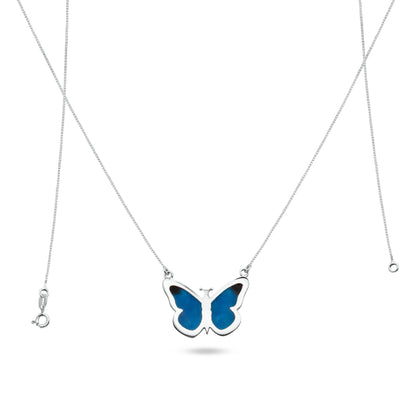 This is a .925 sterling silver necklace with a pendant shaped like a butterfly. The inlay, created using a Brazilian technique, features a striking blue with black accents, all achieved in an environmentally friendly manner.