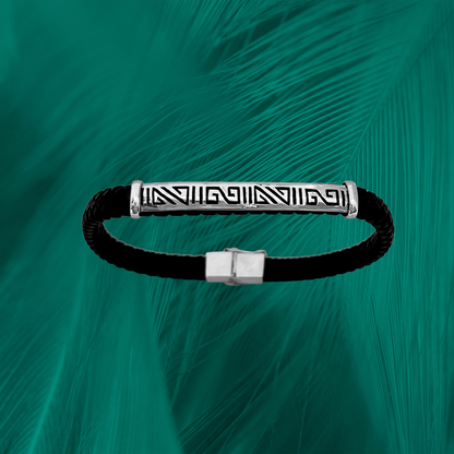 Amazon-inspired bracelet: Intricate sterling silver etching on vegan leather. Geometric design celebrates tribal wisdom and unity.