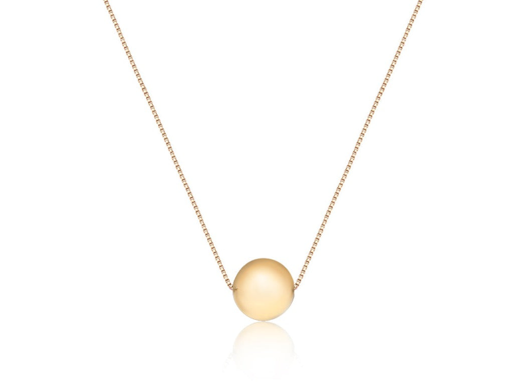 Sleek 18k gold necklace featuring a radiant, orb-like pendant, reflecting the concepts of wholeness and infinity.