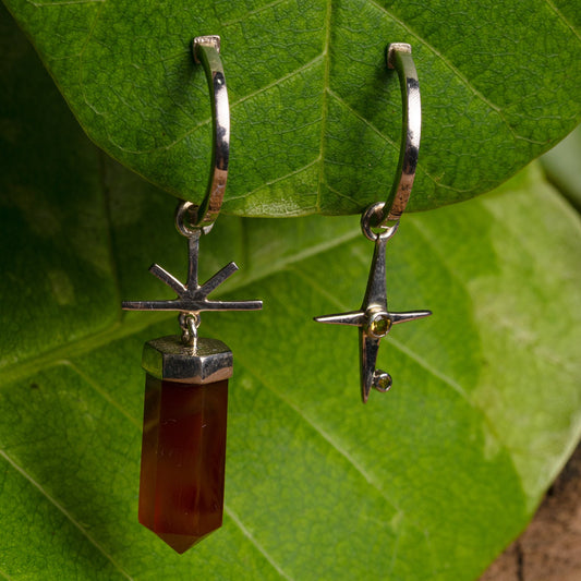 Asymmetrical sterling silver earrings featuring a single agate gemstone and two citrine gemstones on each earring.