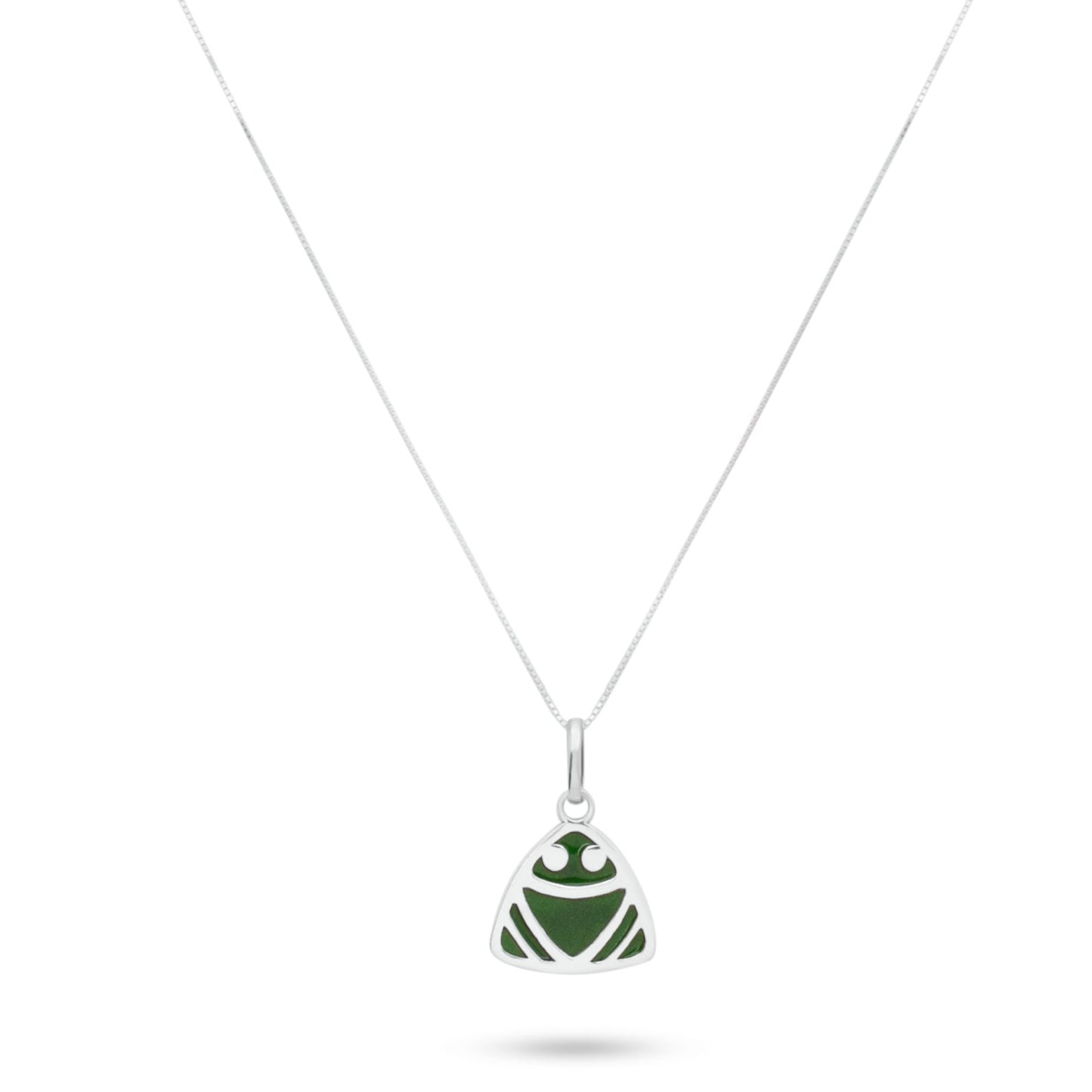 Elegant silver necklace with a muiraquita frog pendant, its green hue crafted from malachite powder using a sustainable local technique.