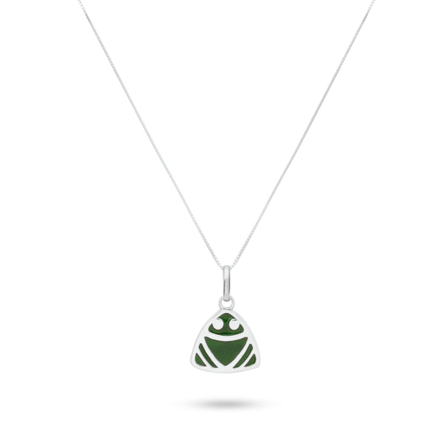 Elegant silver necklace with a triangular pendant, designed to resemble a muiraquita frog in green, using sustainable malachite powder inlay.